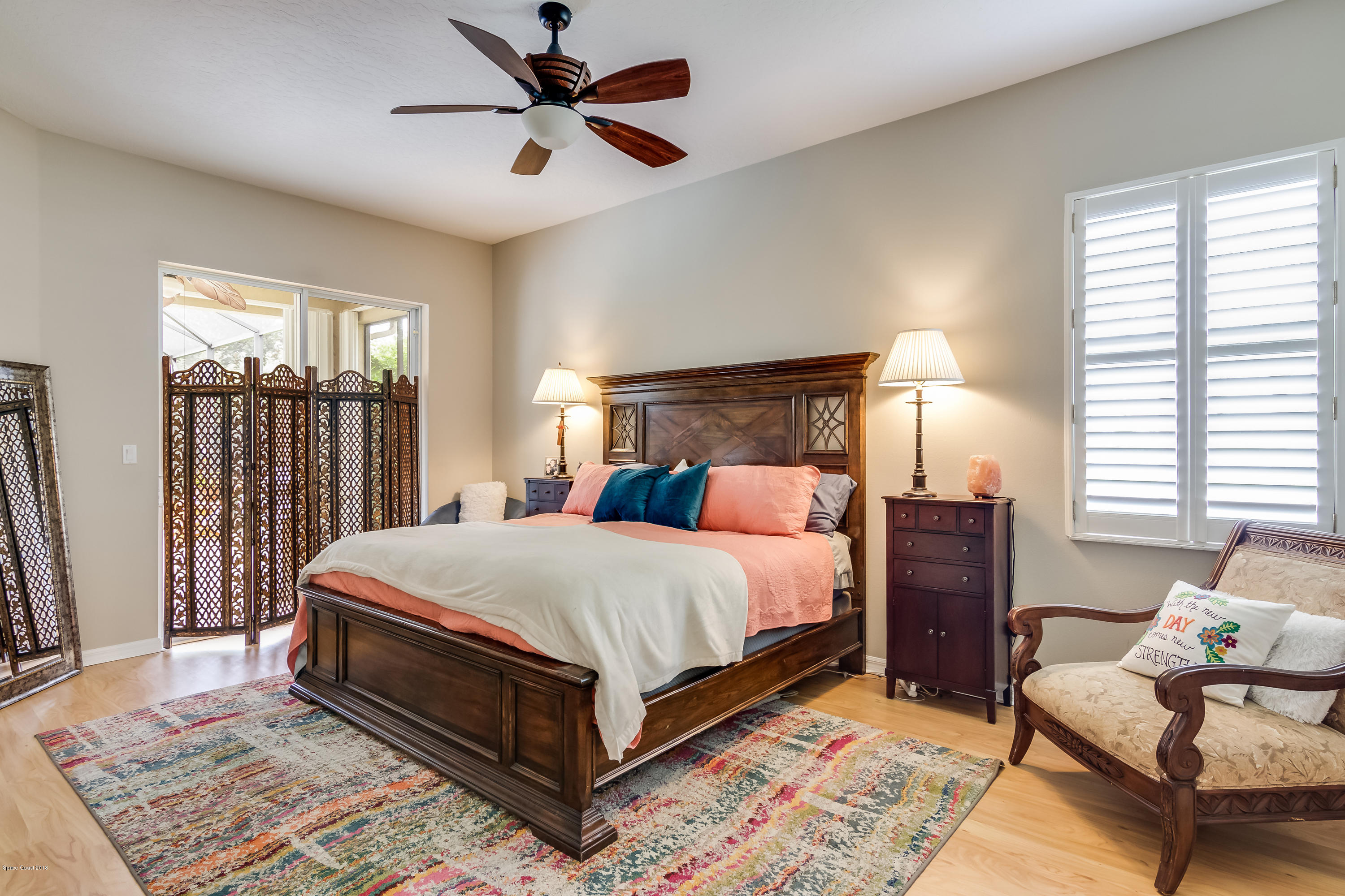 1602 Long Pine Road Melbourne, FL 32940 - Photo 13 of 28 a bed sitting in a bedroom next to a window
