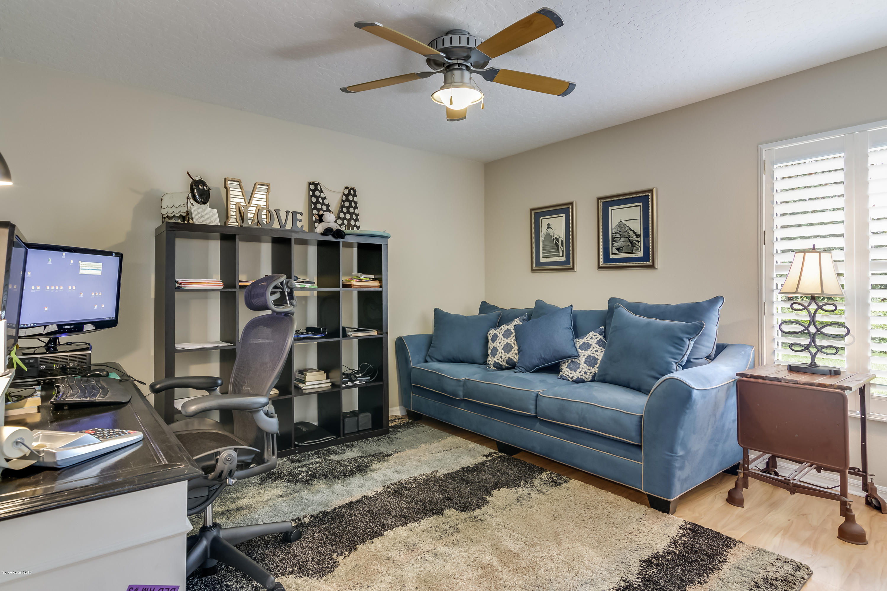 1602 Long Pine Road Melbourne, FL 32940 - Photo 19 of 28 a living room with furniture a air conditioner and a window