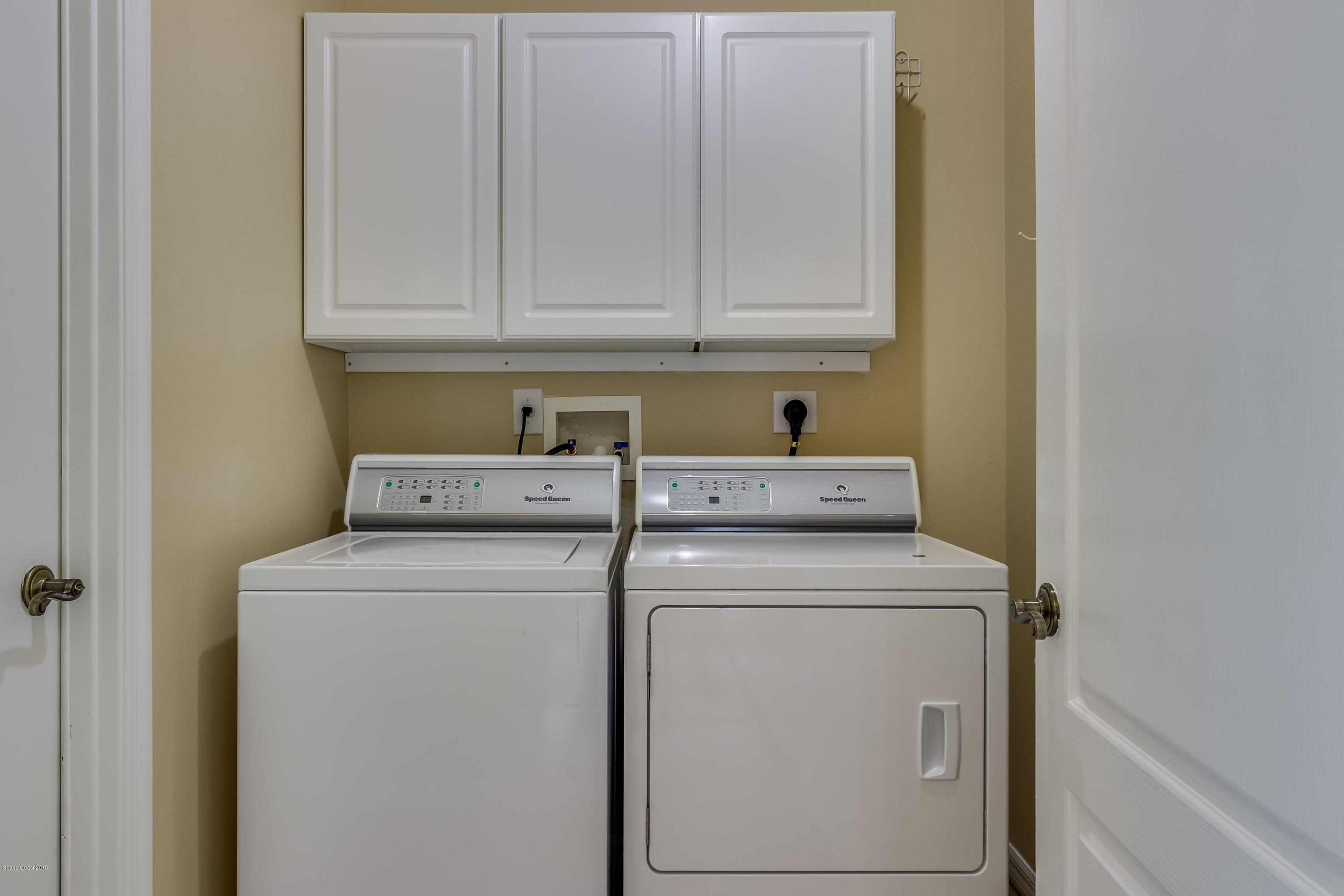 1602 Long Pine Road Melbourne, FL 32940 - Photo 20 of 28 a utility room with dryer and washer