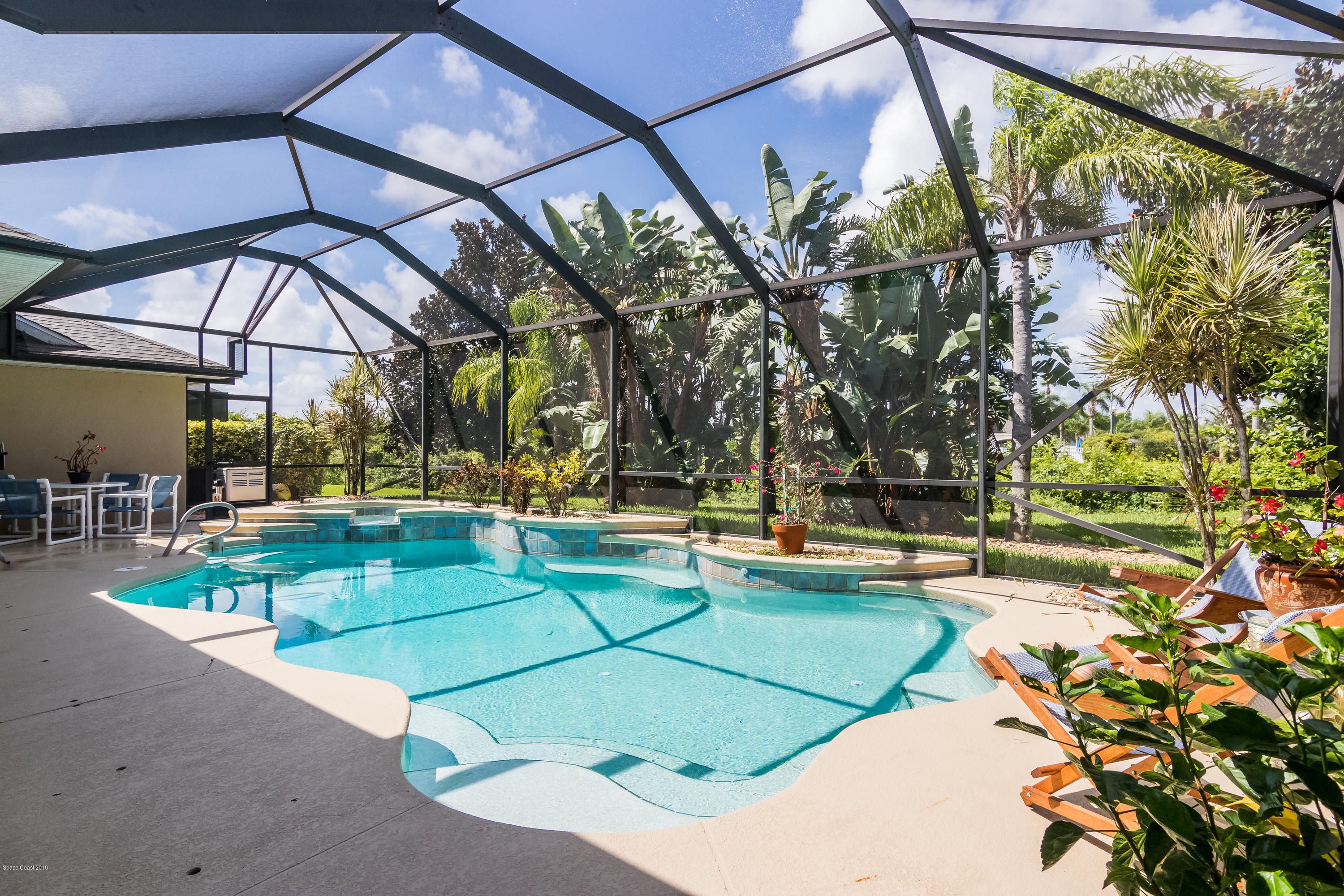 1602 Long Pine Road Melbourne, FL 32940 - Photo 22 of 28 a view of a swimming pool with a patio