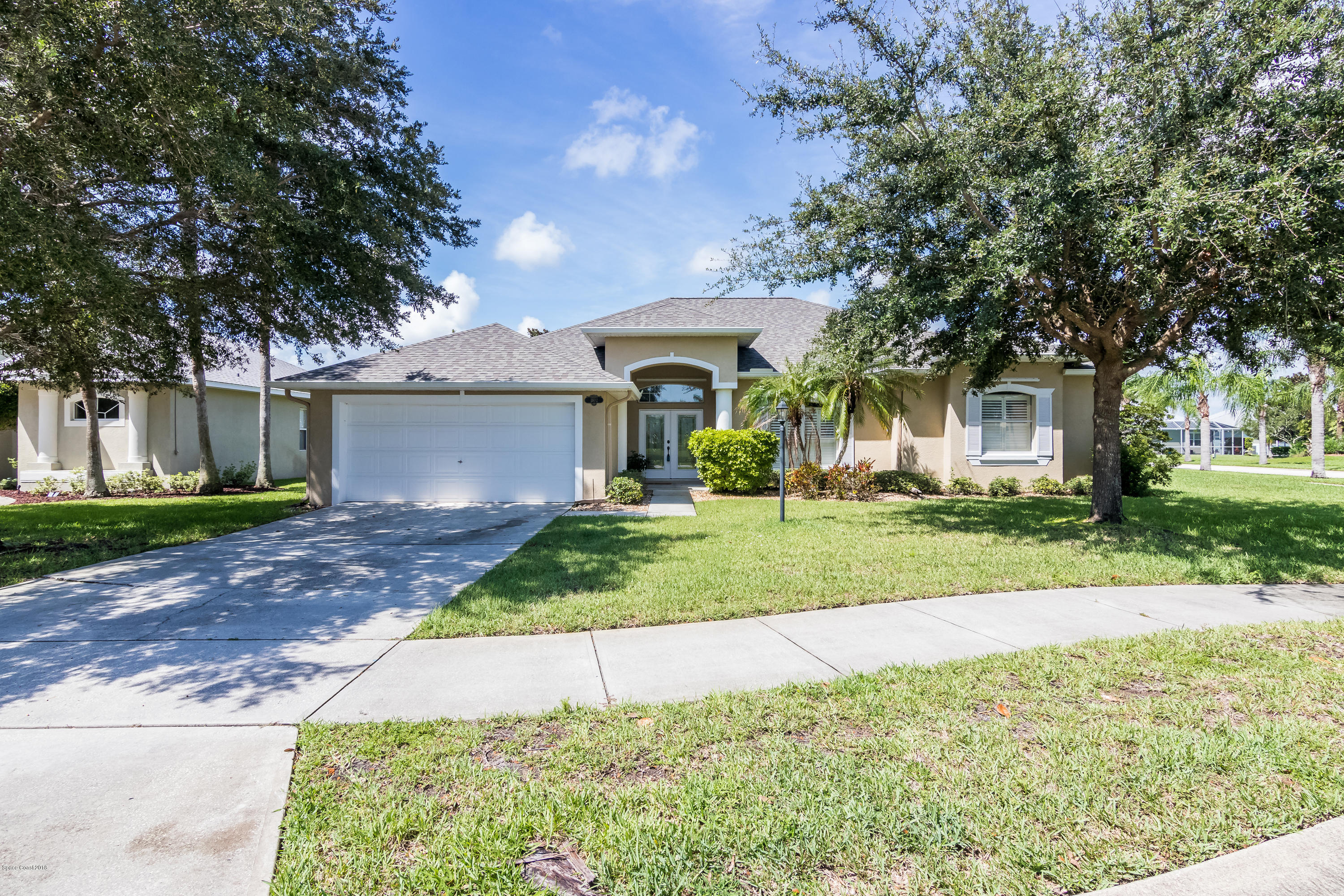 1602 Long Pine Road Melbourne, FL 32940 - Photo 4 of 28 front view of a house with a yard