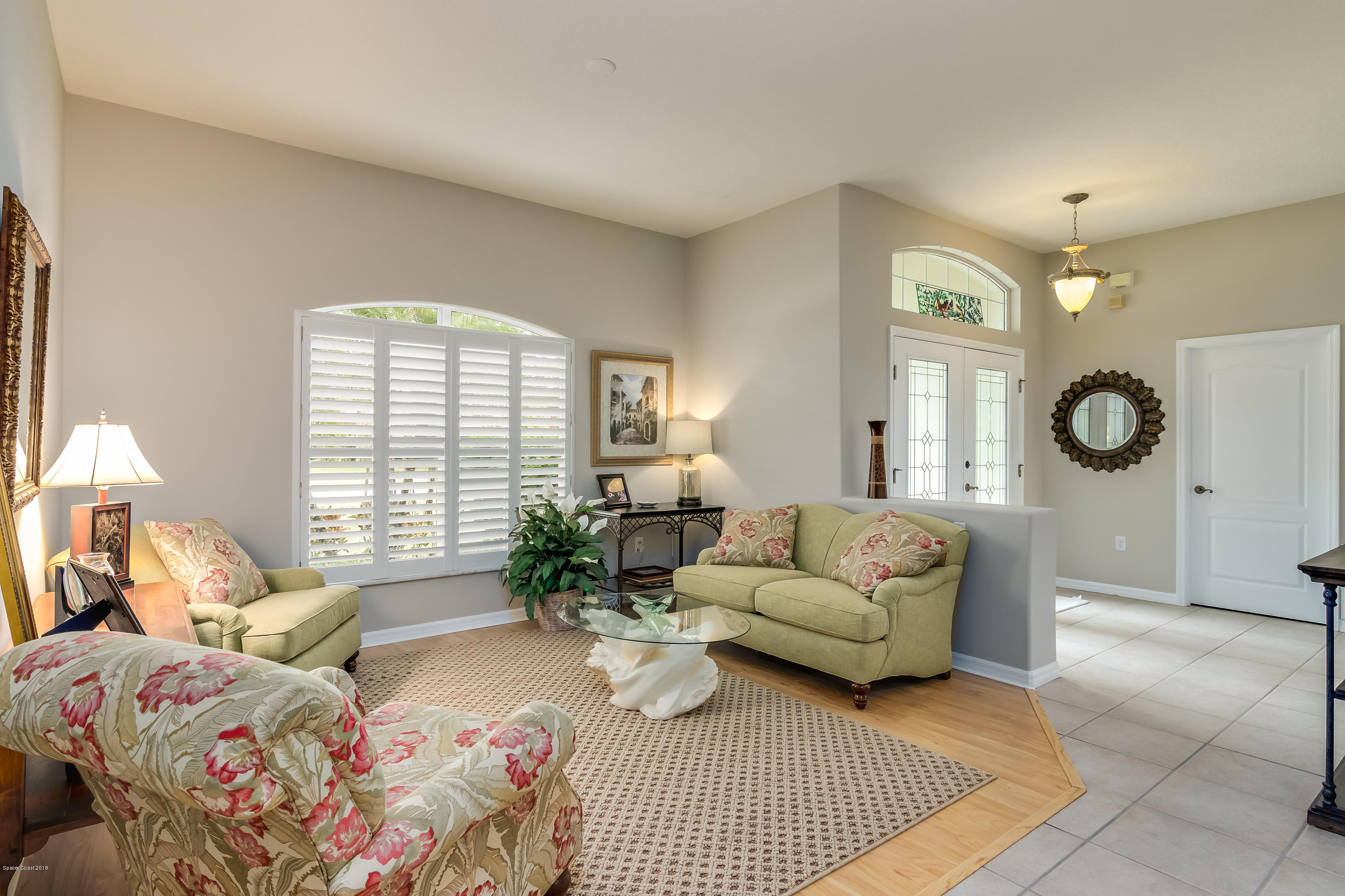 1602 Long Pine Road Melbourne, FL 32940 - Photo 5 of 28 a living room with furniture and a large window