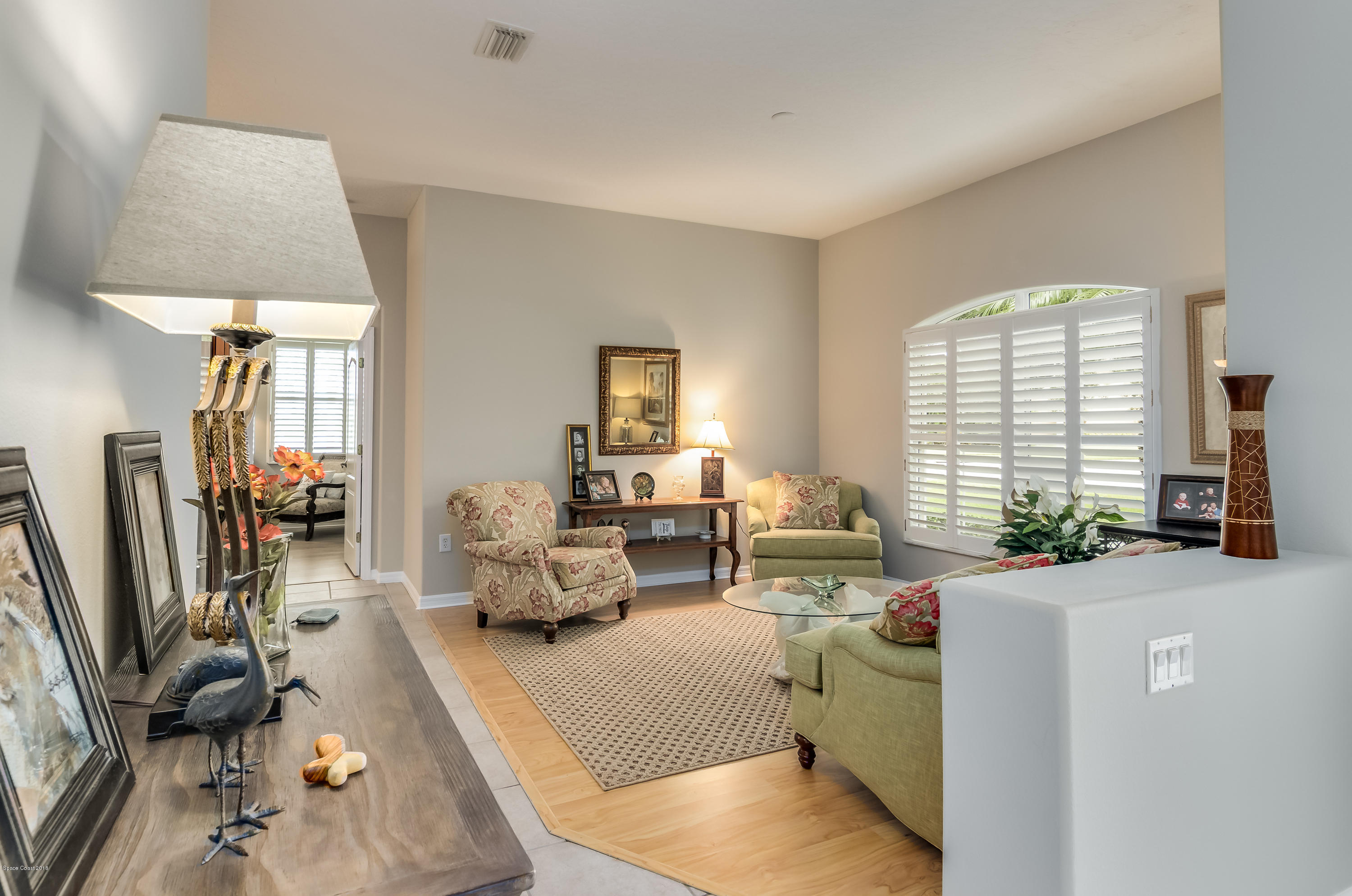 1602 Long Pine Road Melbourne, FL 32940 - Photo 6 of 28 a living room with furniture a window and a flat screen tv