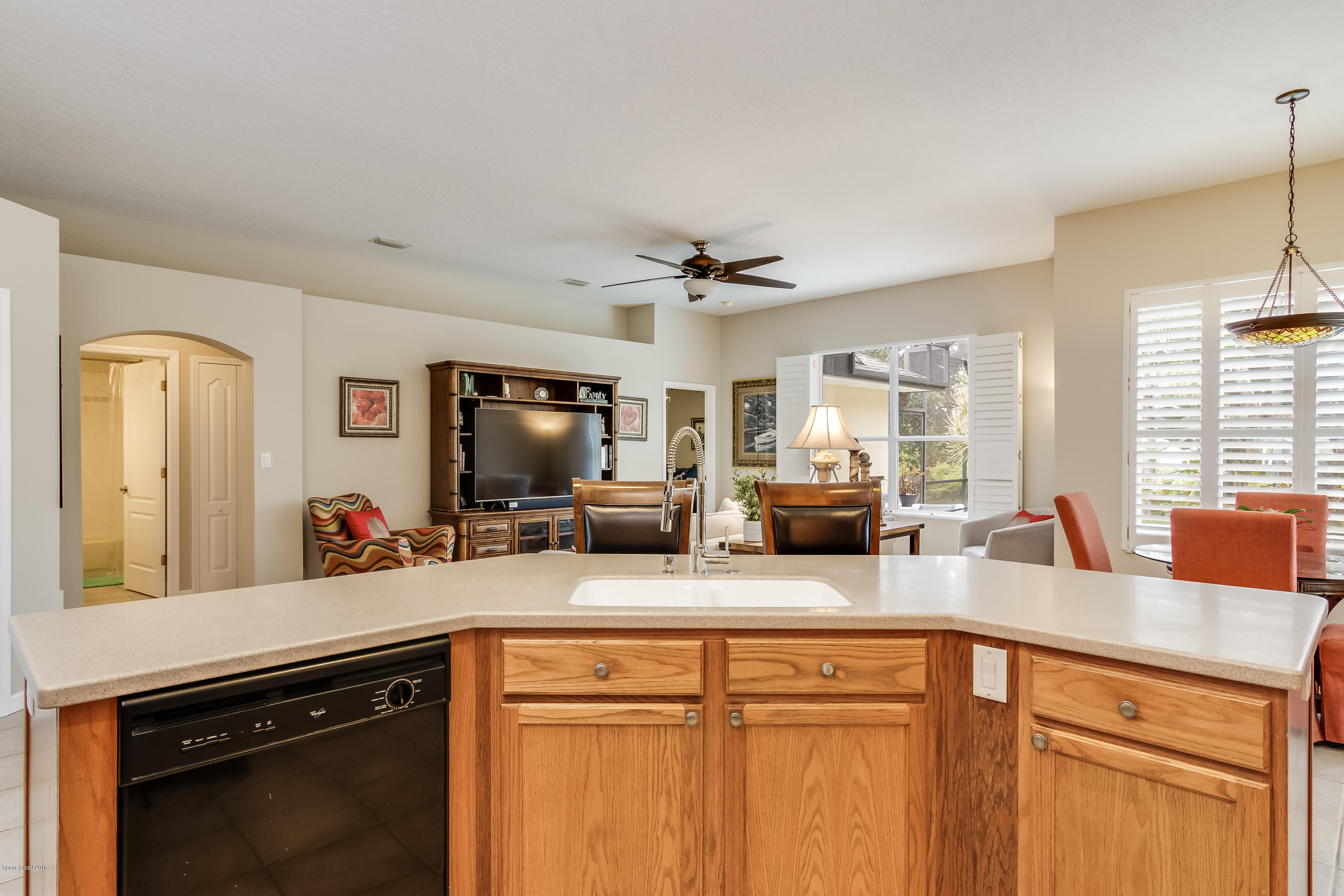 1602 Long Pine Road Melbourne, FL 32940 - Photo 7 of 28 a kitchen with sink refrigerator and window