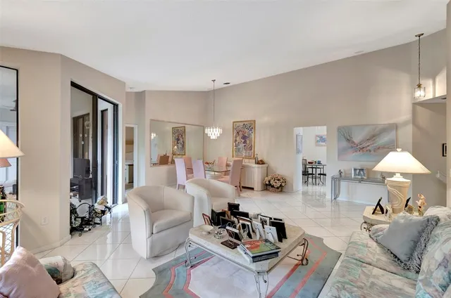 a kitchen with white cabinets a sink and white appliances