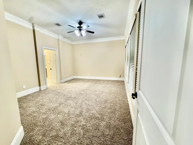 a view of a hallway to a bedroom