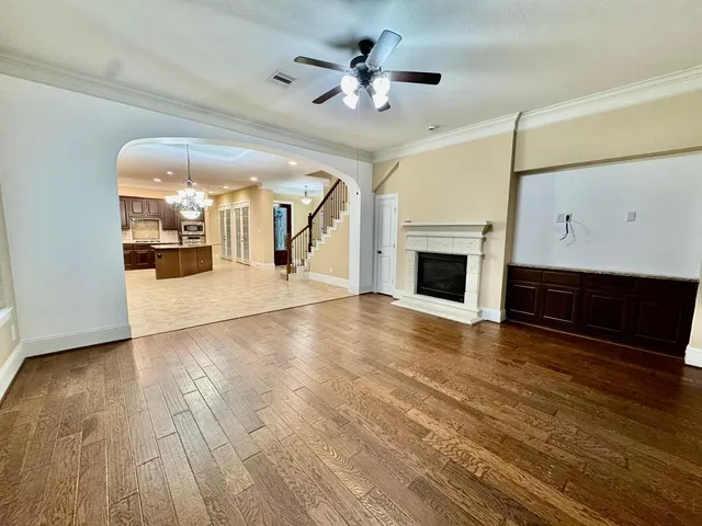 a view of a living room a fireplace with wooden floor