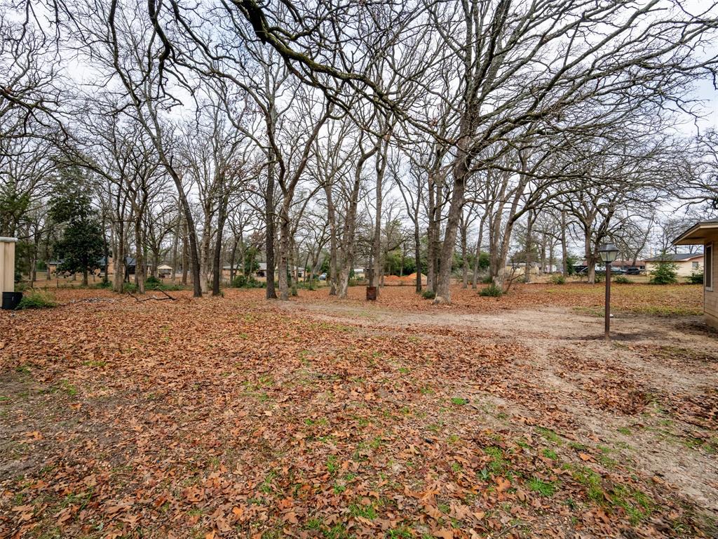 9663 Matise Street Tyler, TX 75706 - Photo 3 of 15 a view of outdoor space with trees