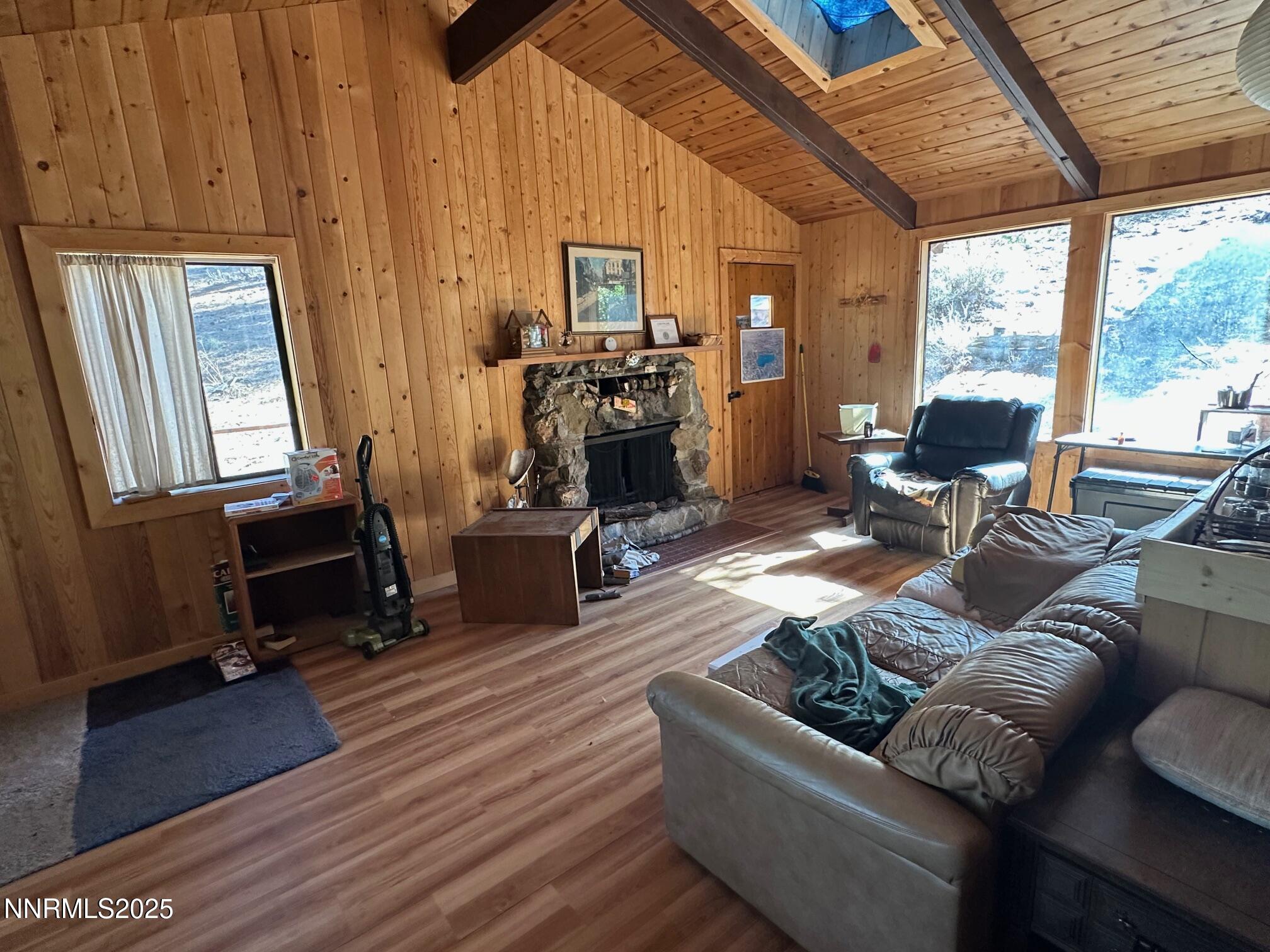 201 Shay Creek Road Markleeville, CA 96120 - Photo 13 of 35 a living room with furniture large window wooden floor and a flat screen tv