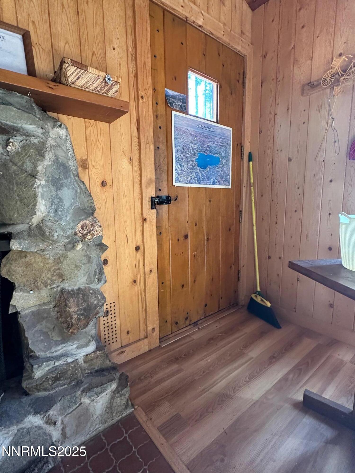 201 Shay Creek Road Markleeville, CA 96120 - Photo 15 of 35 a view of a hallway with wooden floor and staircase
