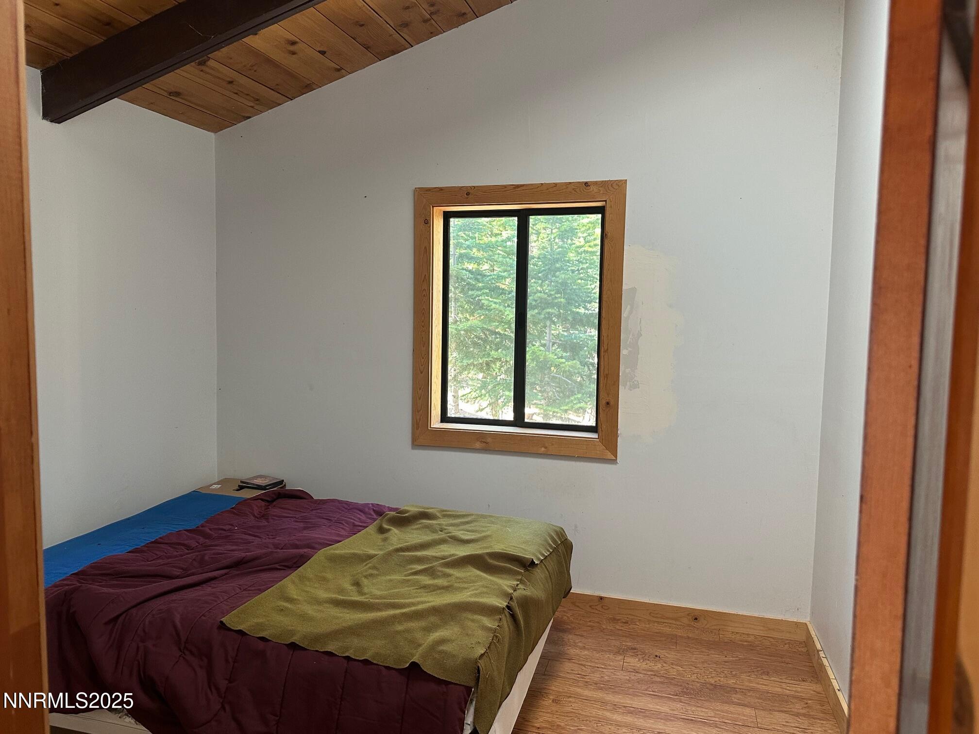 201 Shay Creek Road Markleeville, CA 96120 - Photo 23 of 35 a bed sitting in a bedroom next to a window