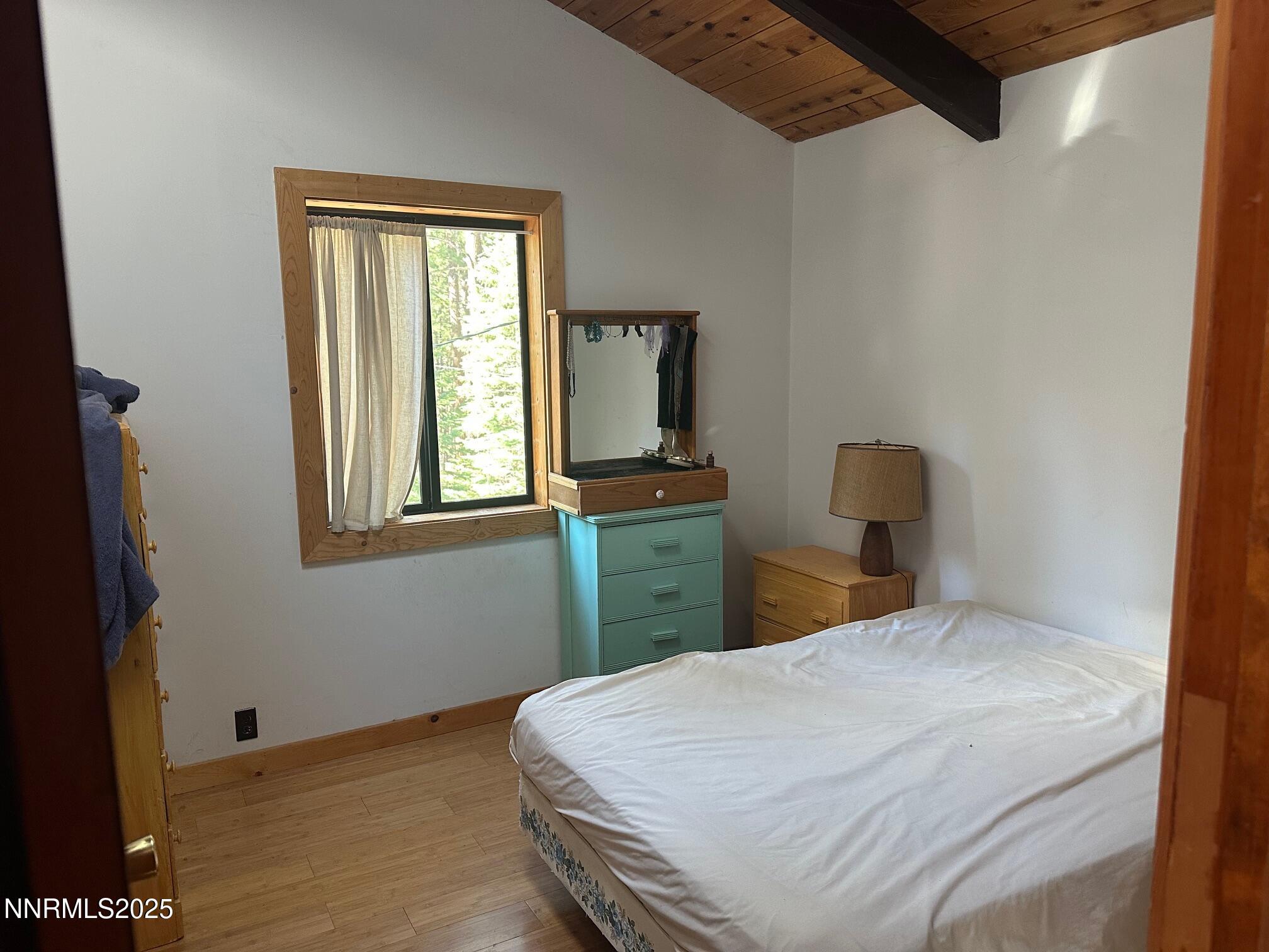 201 Shay Creek Road Markleeville, CA 96120 - Photo 24 of 35 a bedroom with a bed and a window