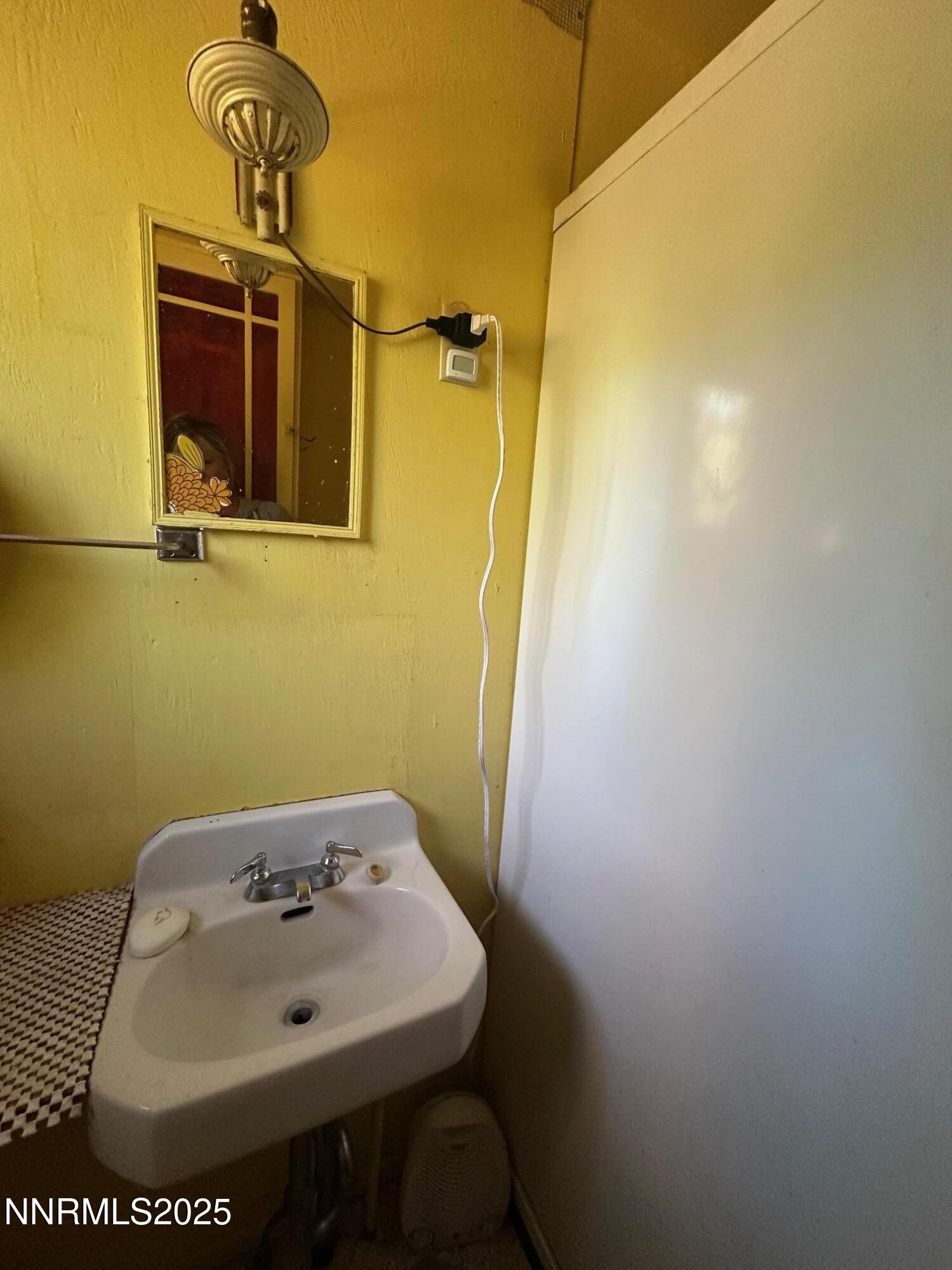201 Shay Creek Road Markleeville, CA 96120 - Photo 27 of 35 a bathroom with a sink and mirror