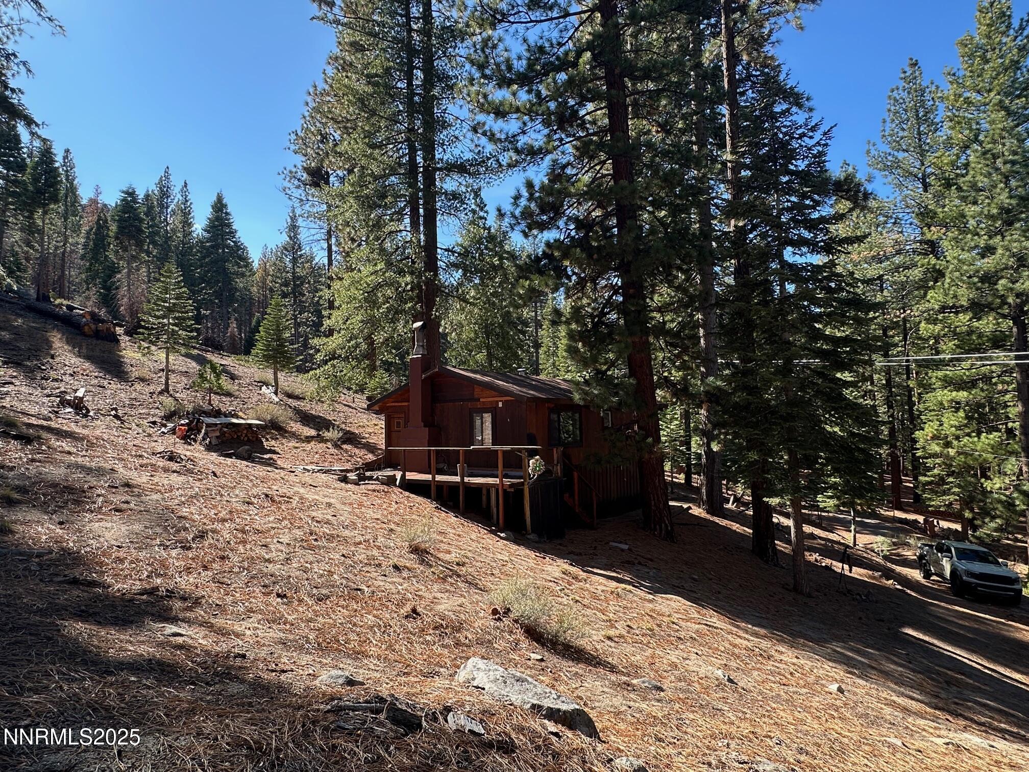 201 Shay Creek Road Markleeville, CA 96120 - Photo 5 of 35 a view of a roof deck with wooden fence and a floor to ceiling window