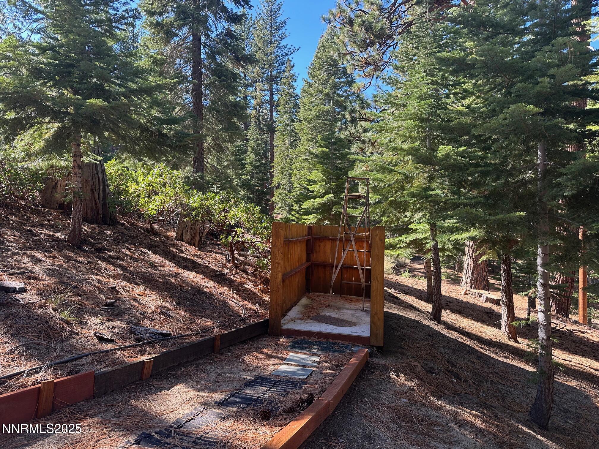 201 Shay Creek Road Markleeville, CA 96120 - Photo 10 of 35 a view of a backyard with wooden fence and a bench