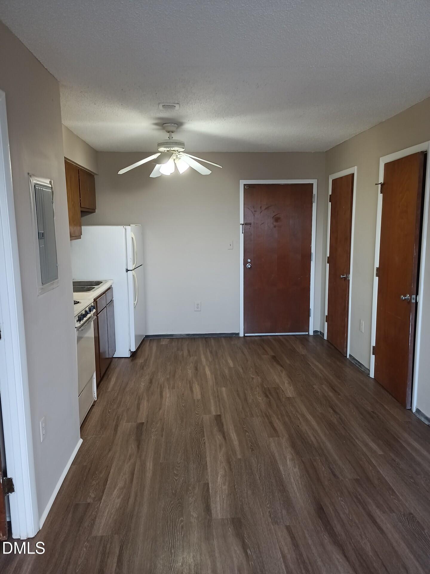 wooden floor in an empty room with a fireplace