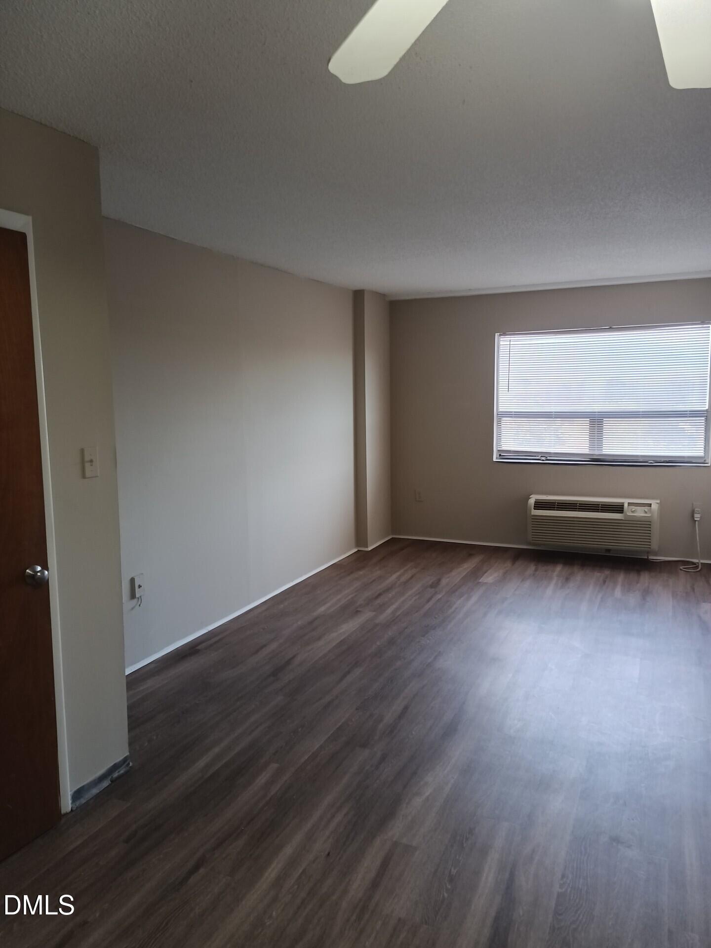 4700 Westgrove Street, Unit 801 Raleigh, NC 27606 - Photo 3 of 4 a view of room with wooden floor and window
