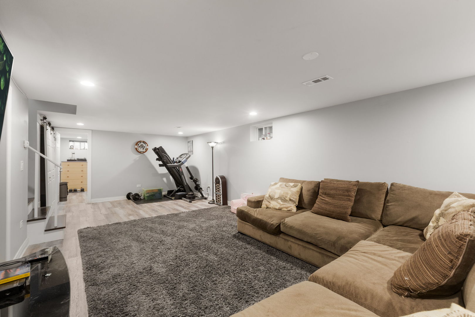 1013 Longaker Road Northbrook, IL 60062 - Photo 16 of 30 a living room with furniture a air conditioner and a table
