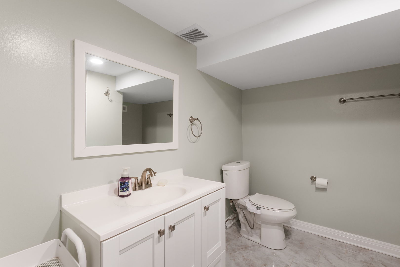 1013 Longaker Road Northbrook, IL 60062 - Photo 20 of 30 a bathroom with a sink toilet and vanity