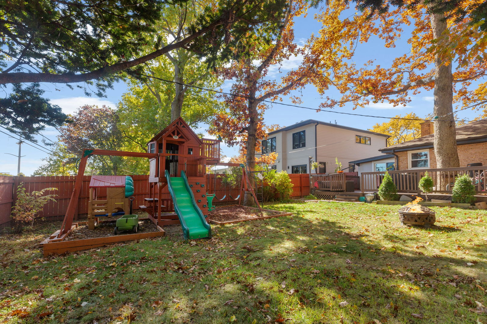 1013 Longaker Road Northbrook, IL 60062 - Photo 25 of 30 a backyard of a house with barbeque oven table and chairs
