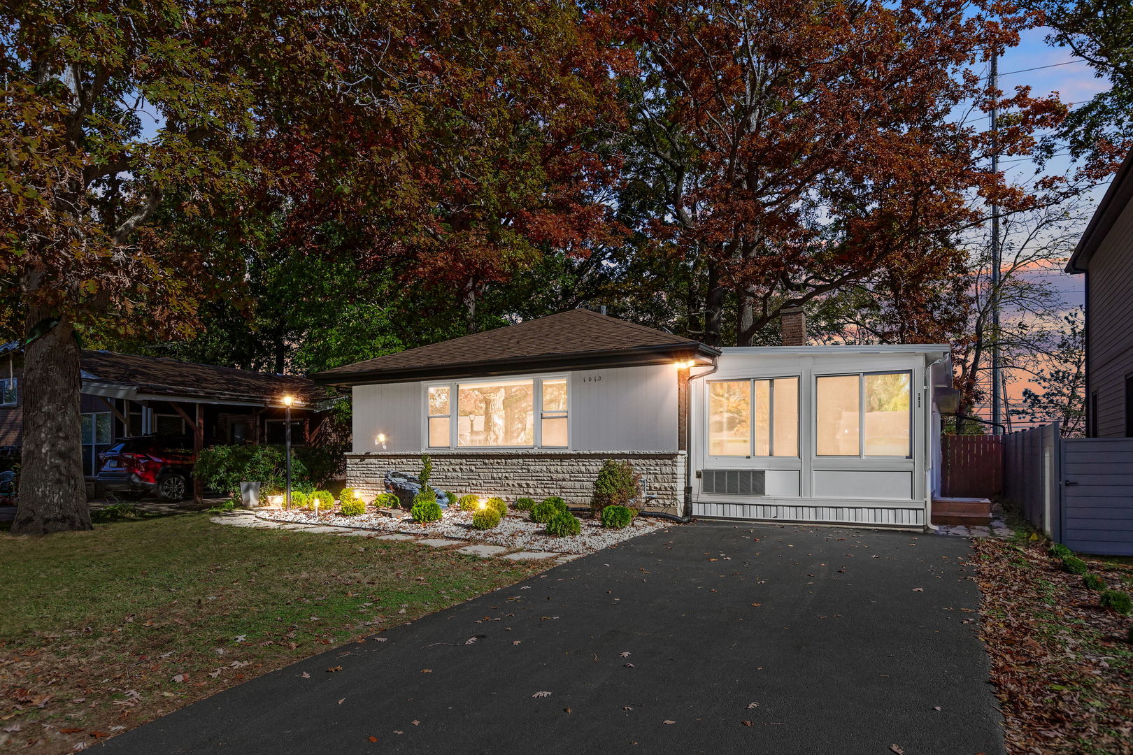 1013 Longaker Road Northbrook, IL 60062 - Photo 27 of 30 a front view of a house with a yard and a large tree