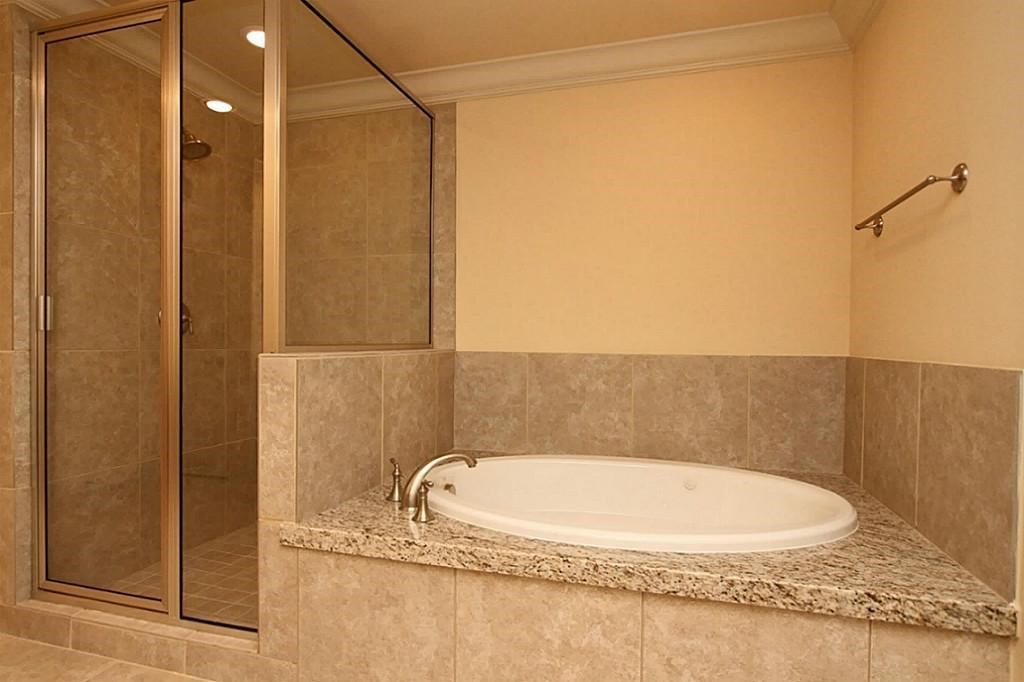 14478 Summerleaf Lane Houston, TX 77077 - Photo 19 of 26 a bathroom with a granite countertop sink and a mirror