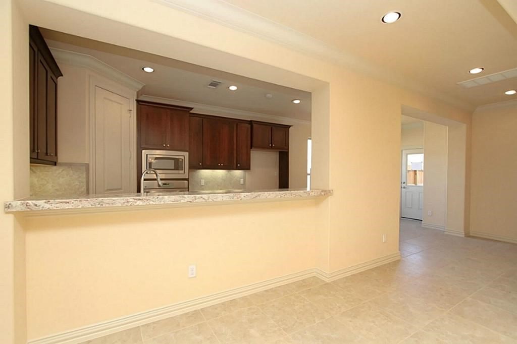 14478 Summerleaf Lane Houston, TX 77077 - Photo 5 of 26 a view of a kitchen with a sink and a refrigerator