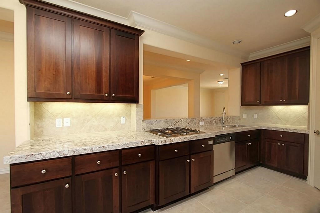 14478 Summerleaf Lane Houston, TX 77077 - Photo 7 of 26 a kitchen with a sink and cabinets