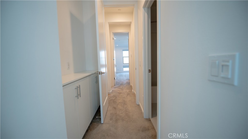 339 Placemark Irvine, CA 92614 - Photo 14 of 30 a view of a hallway with wooden floor and closet