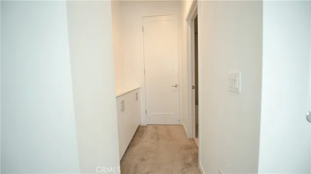 a view of kitchen with wooden floor and electronic appliances
