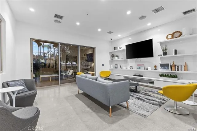 a large white kitchen with lots of counter space and a sink