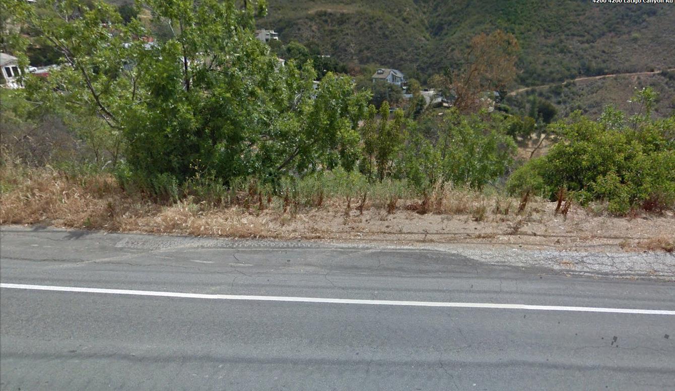 Latigo Cyn Road Malibu, CA 90265 - Photo 6 of 20 a view of a yard and a house