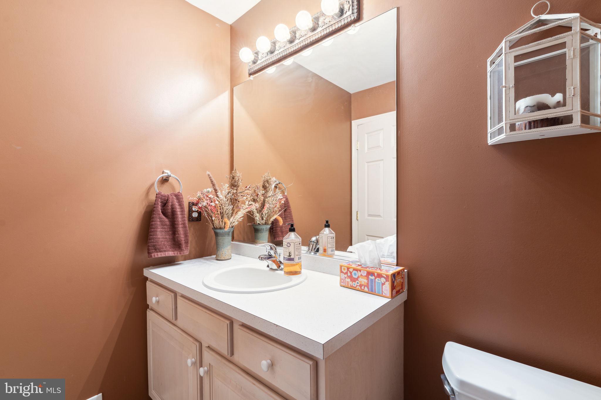 22 Devonshire Drive Voorhees, NJ 08043 - Photo 27 of 54 a bathroom with a sink vanity and a mirror