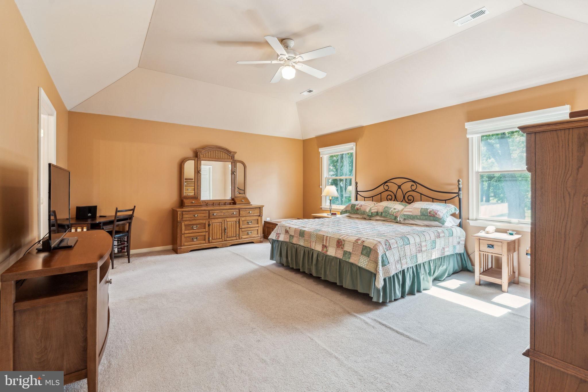 22 Devonshire Drive Voorhees, NJ 08043 - Photo 29 of 54 a bedroom with a bed and a chandelier