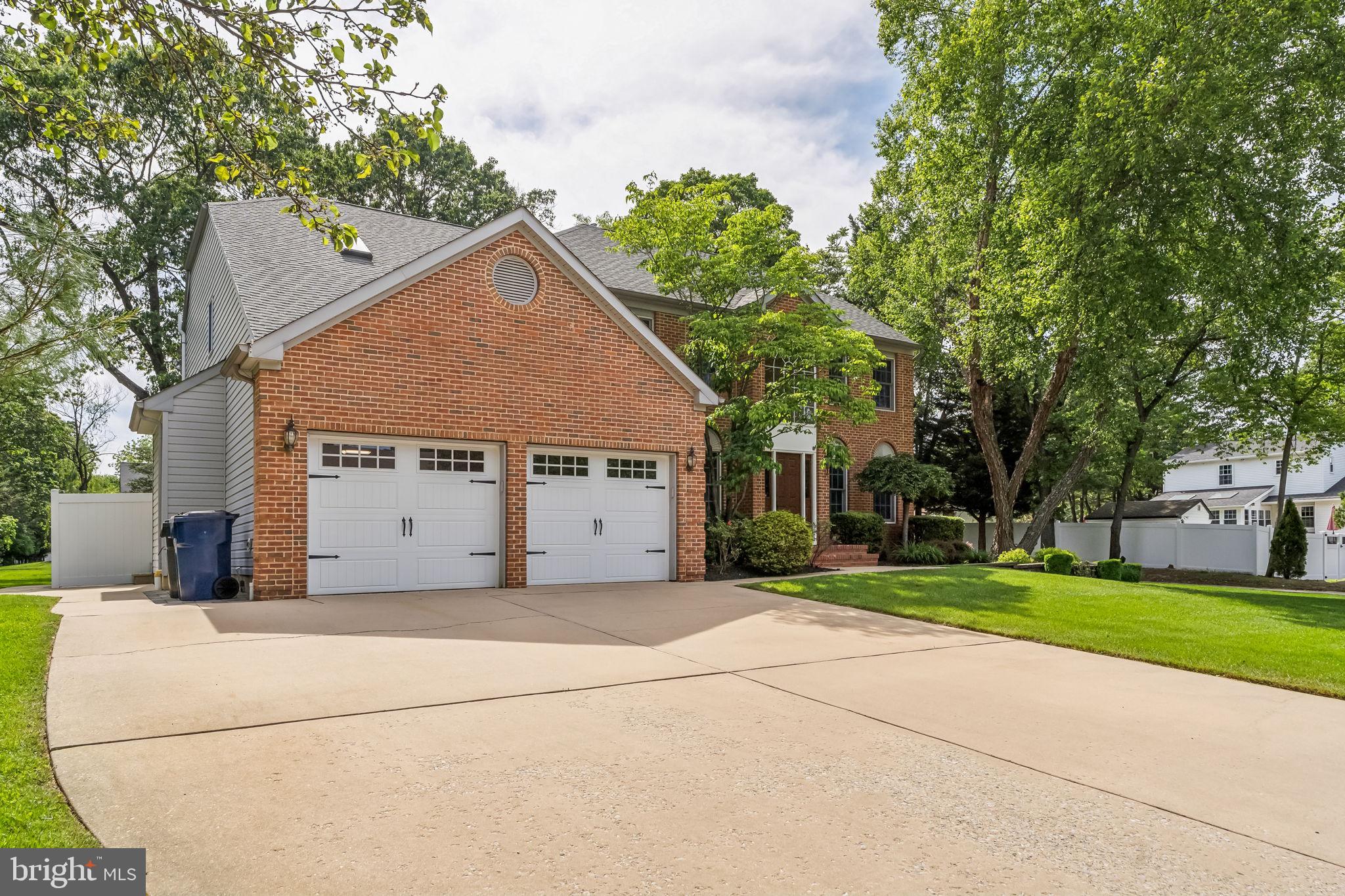 22 Devonshire Drive Voorhees, NJ 08043 - Photo 3 of 54 a view of a house with a small yard and large trees