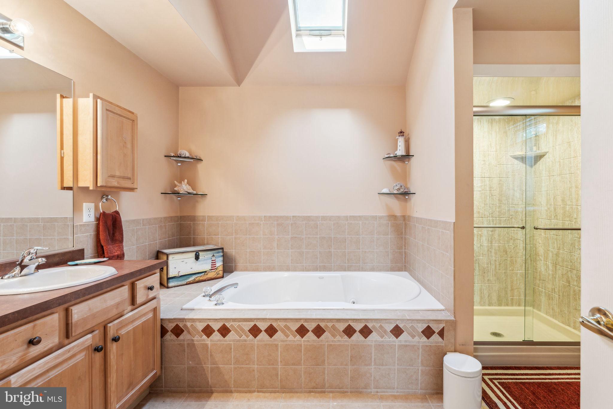 22 Devonshire Drive Voorhees, NJ 08043 - Photo 33 of 54 a bathroom with a granite countertop sink a toilet and shower