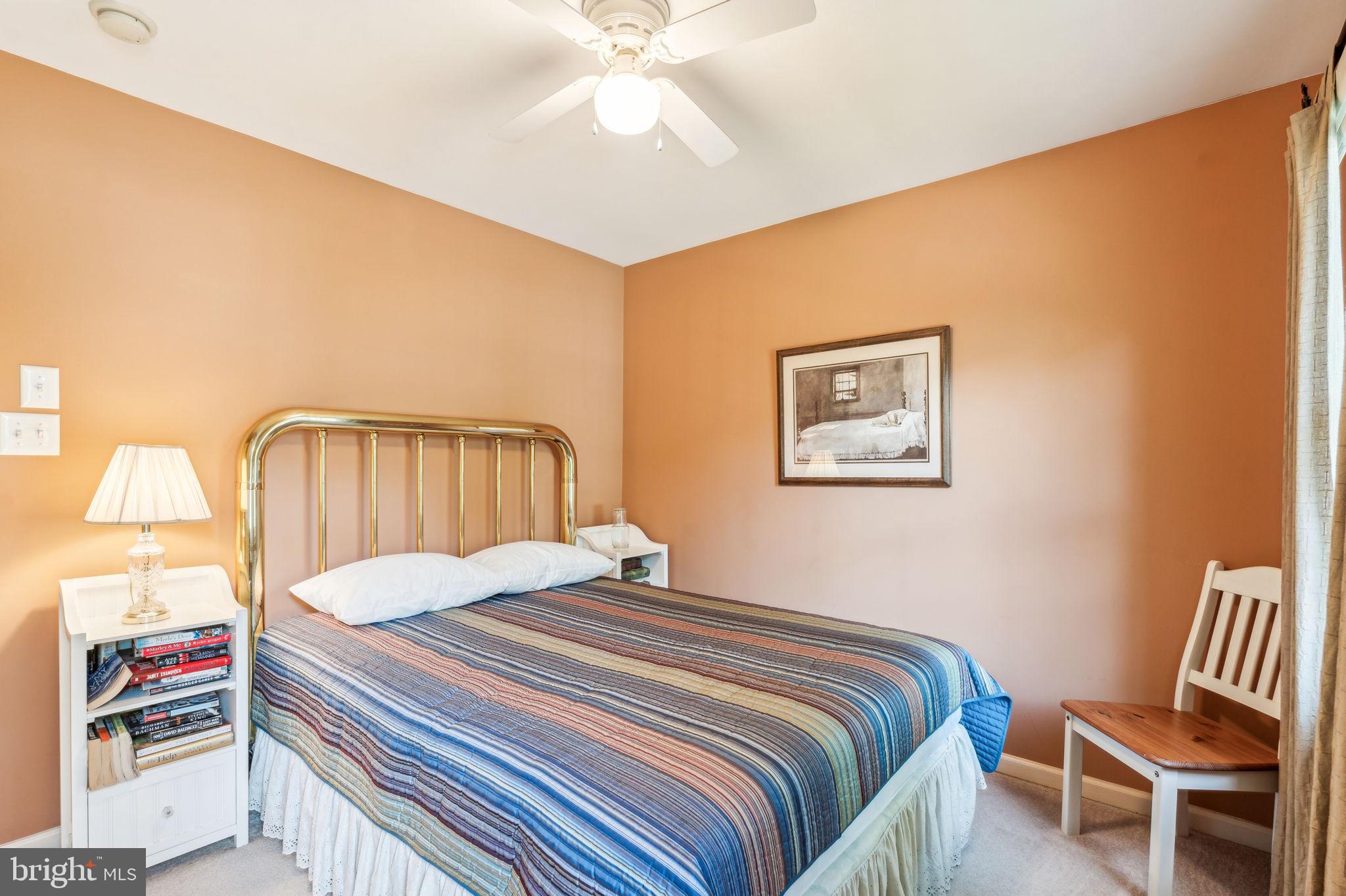 22 Devonshire Drive Voorhees, NJ 08043 - Photo 39 of 54 a bedroom with a bed and a chair