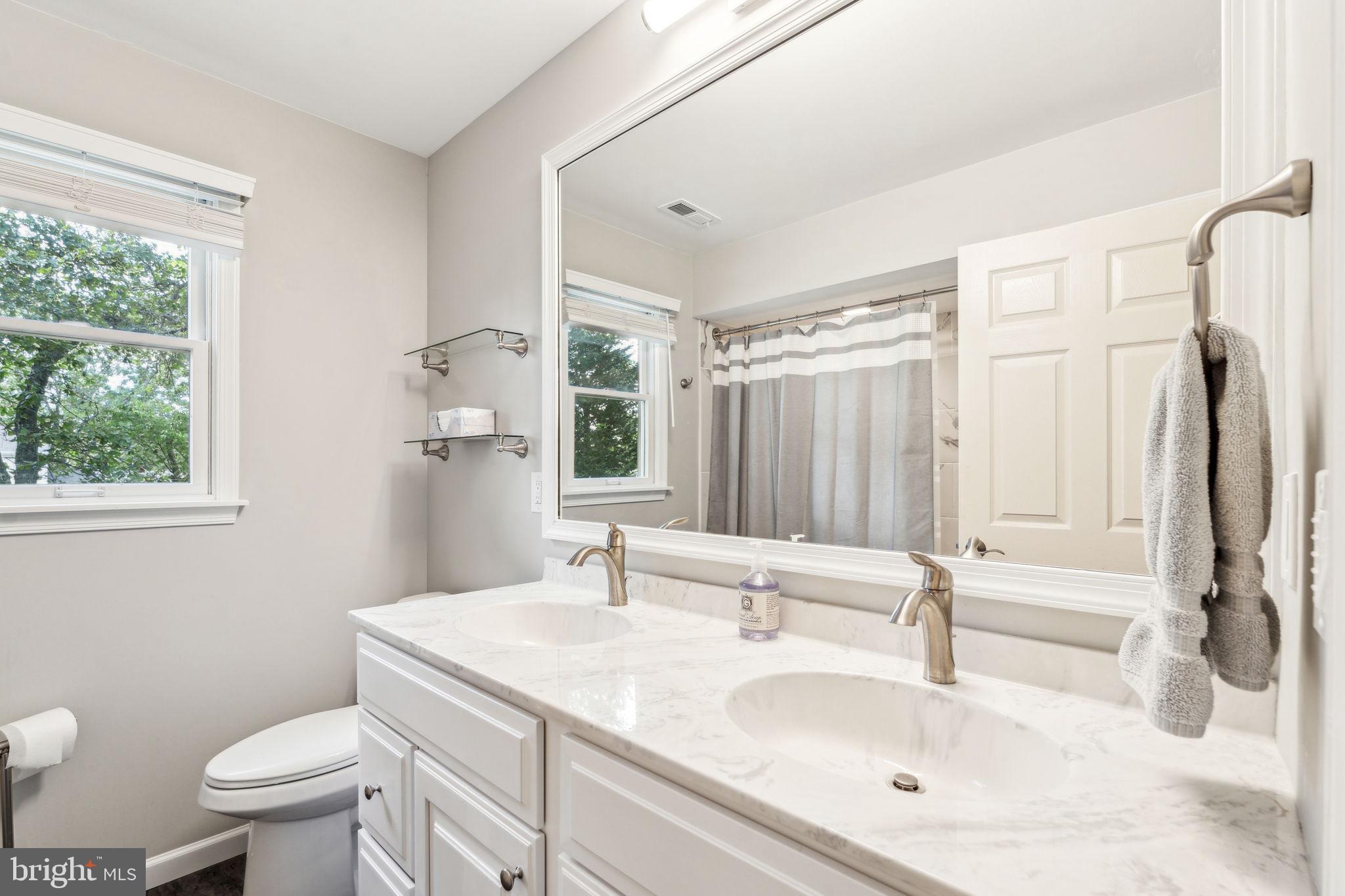 22 Devonshire Drive Voorhees, NJ 08043 - Photo 40 of 54 a bathroom with a sink toilet double vanity and tub