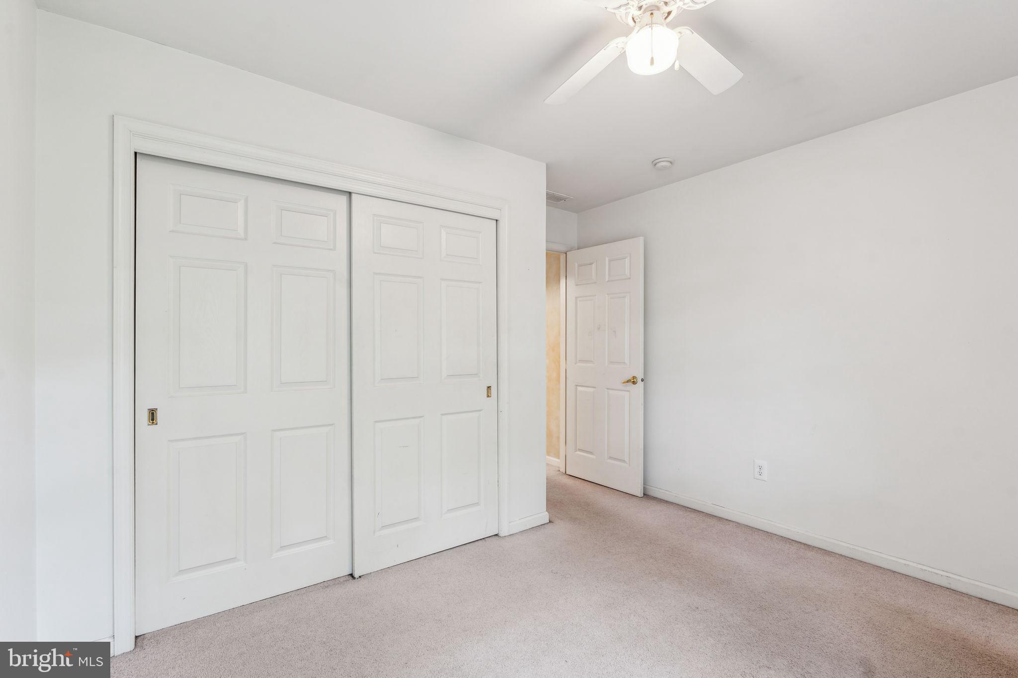 22 Devonshire Drive Voorhees, NJ 08043 - Photo 43 of 54 an empty room with a ceiling fan