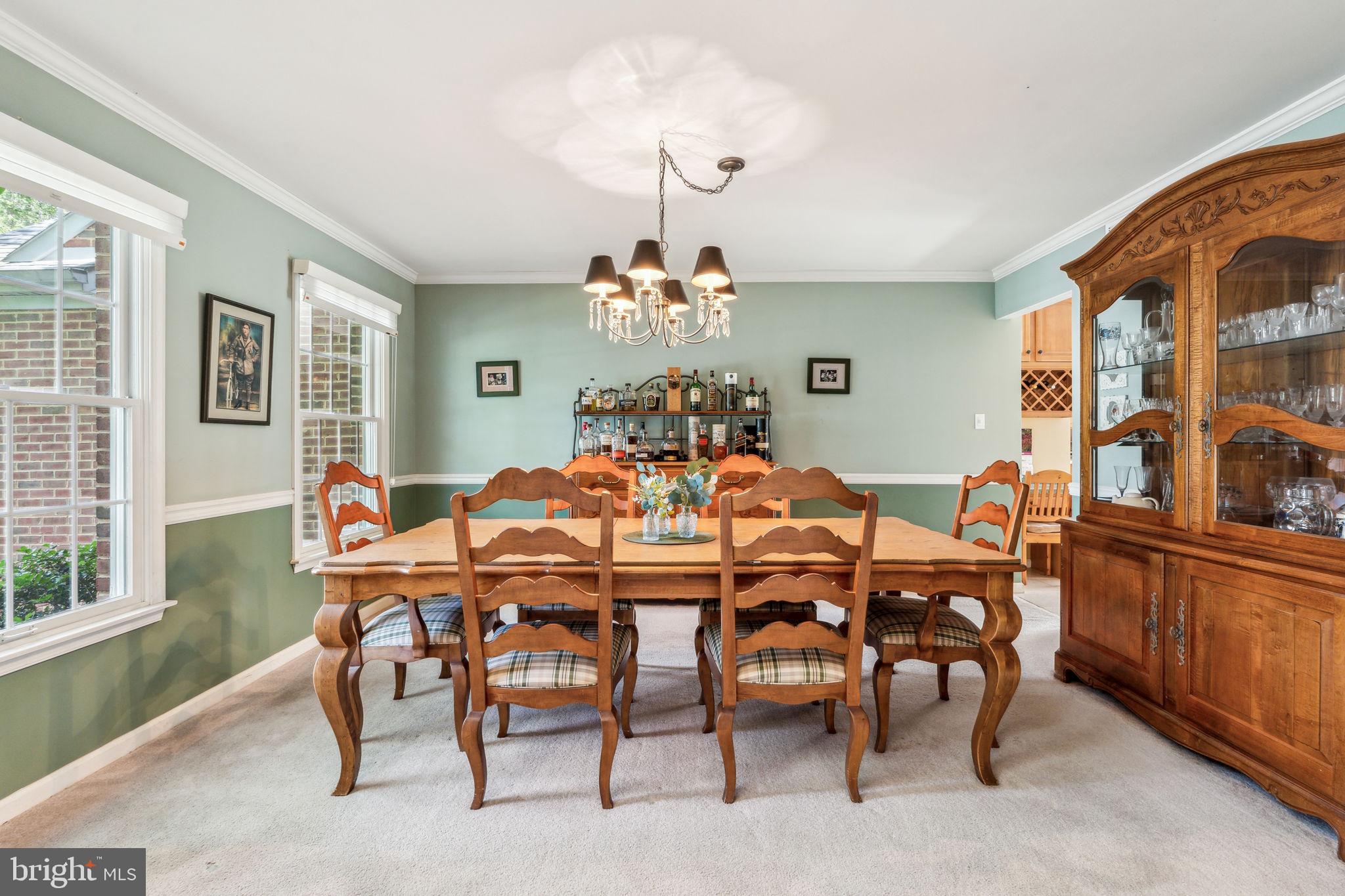 22 Devonshire Drive Voorhees, NJ 08043 - Photo 7 of 54 a view of a dining room with furniture and chandelier