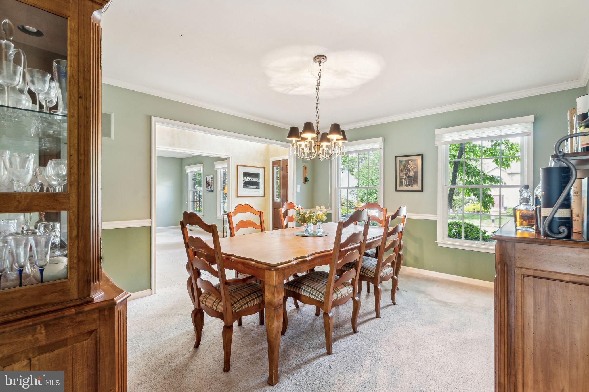 22 Devonshire Drive Voorhees, NJ 08043 - Photo 9 of 54 a dining room with furniture a chandelier and window
