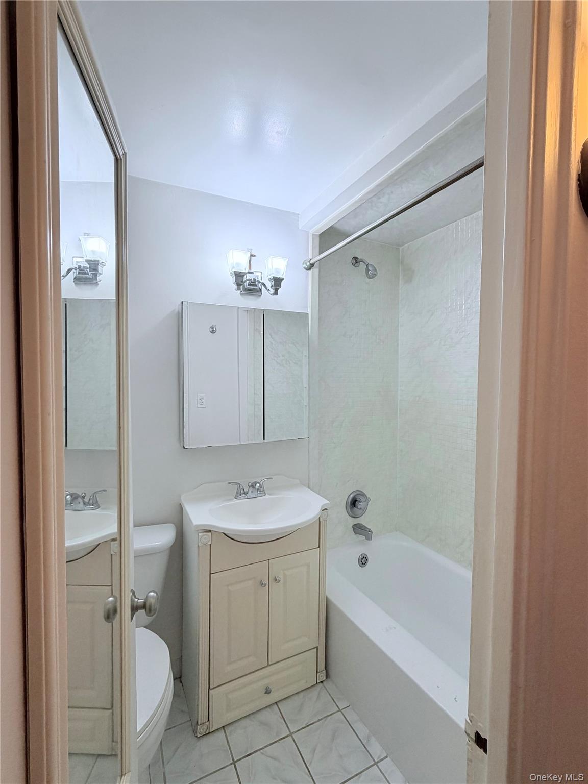 99-21 67th Road, Unit 3A Queens, NY 11375 - Photo 13 of 22 a bathroom with a sink a toilet and shower