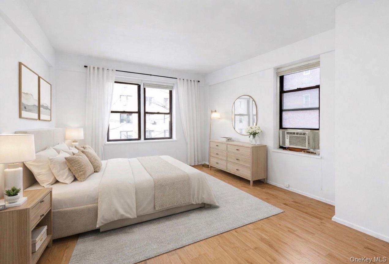 99-21 67th Road, Unit 3A Queens, NY 11375 - Photo 15 of 22 a bedroom with a bed and a window