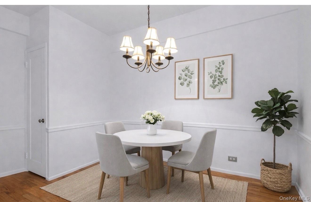 99-21 67th Road, Unit 3A Queens, NY 11375 - Photo 4 of 22 a view of a dining room with furniture wooden floor and a chandelier