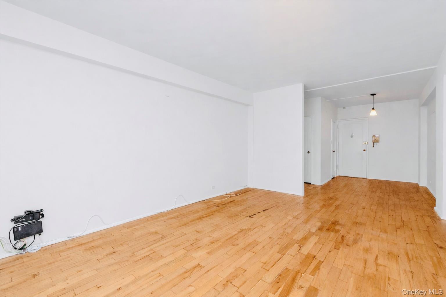 99-21 67th Road, Unit 3A Queens, NY 11375 - Photo 8 of 22 a bedroom with a bed and a rug