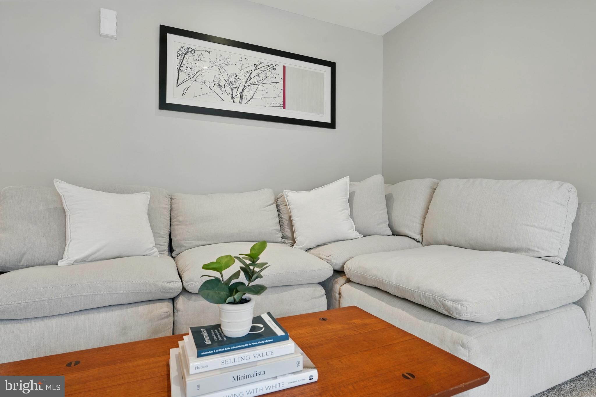 7045 Sauvage Lane Gainesville, VA 20155 - Photo 12 of 43 a living room with furniture potted plant and a lamp