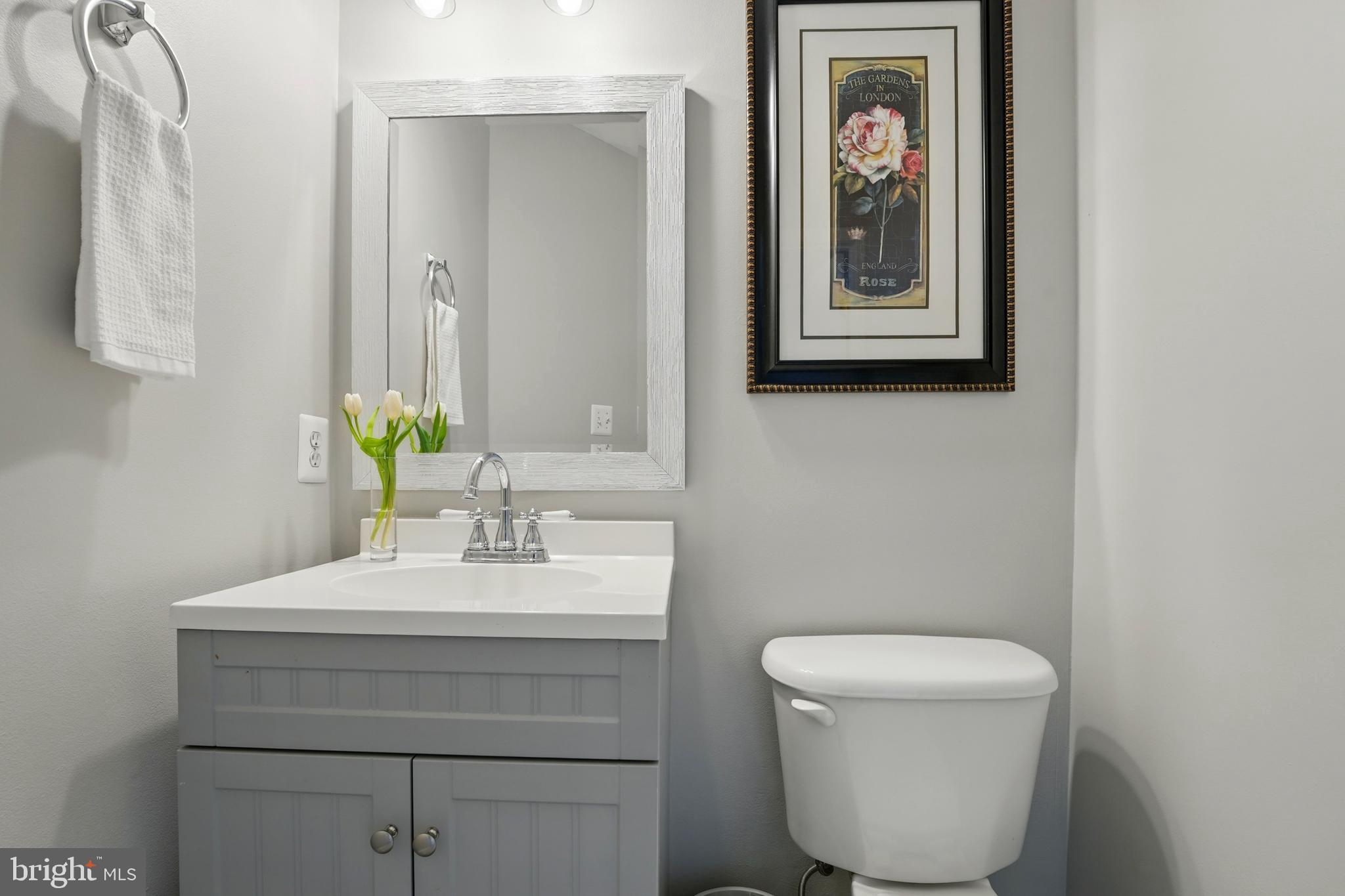 7045 Sauvage Lane Gainesville, VA 20155 - Photo 13 of 43 a bathroom with a toilet sink and mirror
