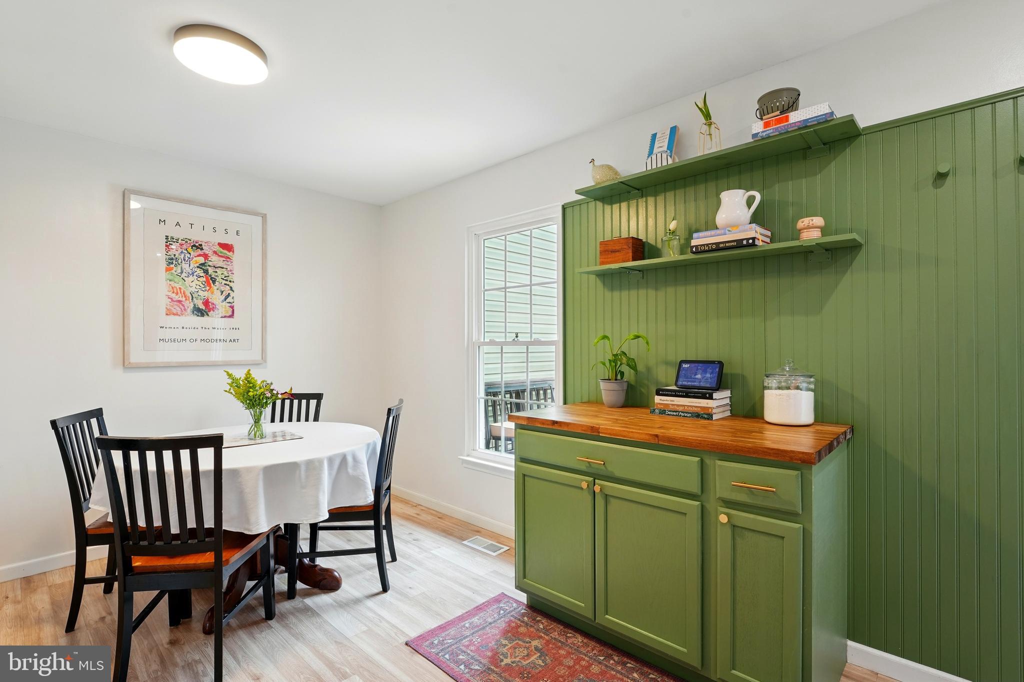 7045 Sauvage Lane Gainesville, VA 20155 - Photo 15 of 43 a dining room with a table and chairs