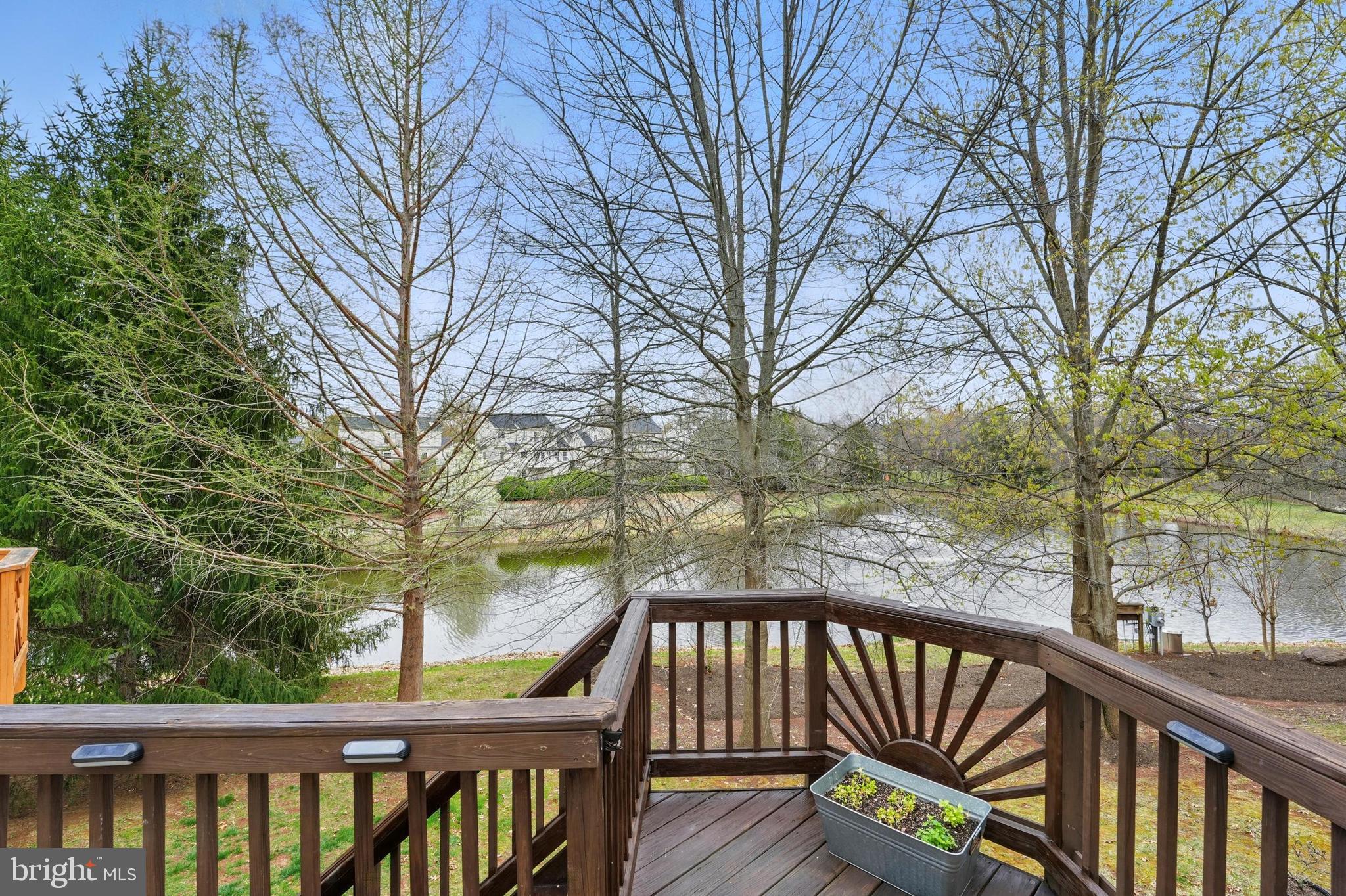 7045 Sauvage Lane Gainesville, VA 20155 - Photo 20 of 43 a view of trees and deck with wooden floor and fence