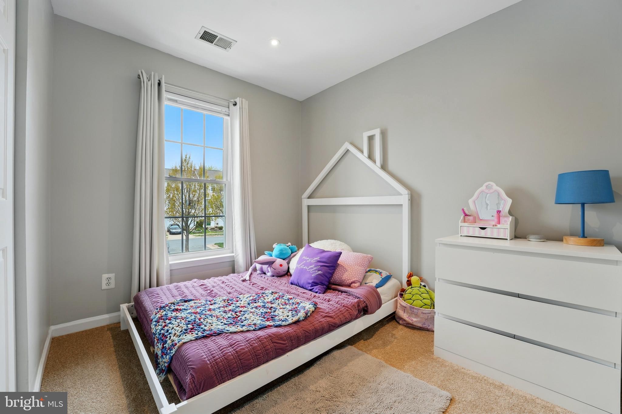 7045 Sauvage Lane Gainesville, VA 20155 - Photo 26 of 43 a bedroom with a bed and a window